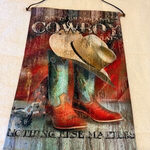 “Boots, Chaps & Cowboy Hats…NOTHING ELSE MATTERS” wall hanging. 17” X 26”